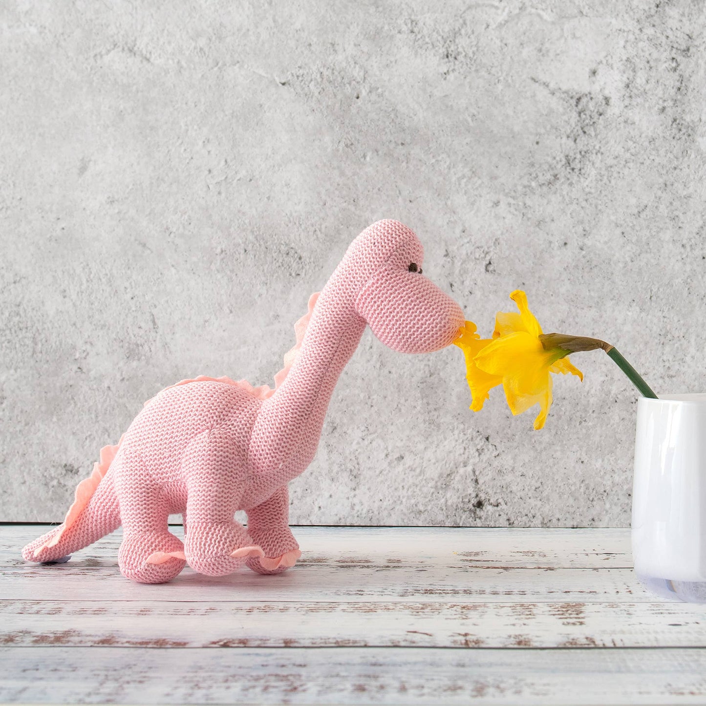 Rosa Diplodocus Babyrassel – Bio-Baumwolle, ab Geburt